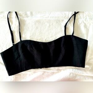 Super cute size medium CAARA black‎ top. Rayon and line.  Zips in back